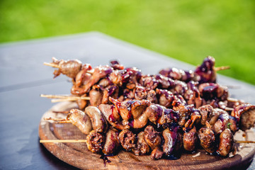 meat kebab skewers on the grill, chicken hearts,