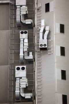 Anthropomorphic air vents on side of building