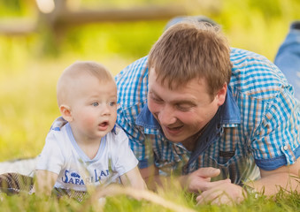 father and son having fun playing outdoors