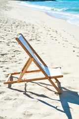 Beautiful beach landscape with chair for relaxation. Travel background