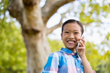 Portrait of smiling girl talking on mobile phone