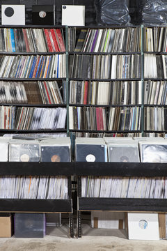 Rows of records on shelves and in bins at a record store