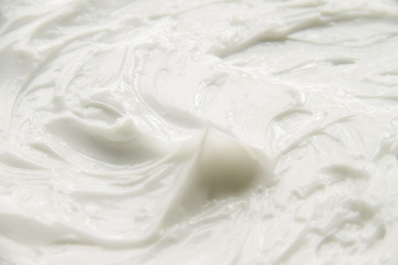 Cosmetics. Cream white background texture.