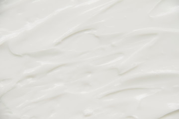 Cosmetics. Cream white background texture.