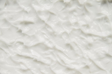 Naklejka na ściany i meble Cosmetics. Cream white background texture.