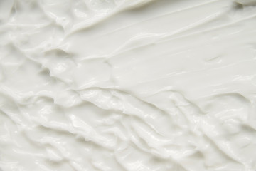 Cosmetics. Cream white background texture.