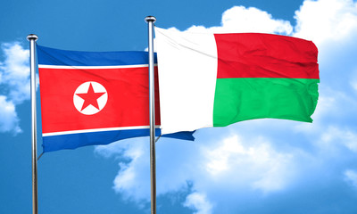 North Korea flag with Madagascar flag, 3D rendering