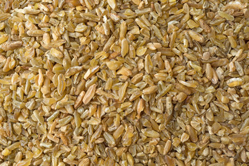 Close view of cracked freekeh grain.