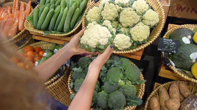 Female Customer Shopping for Vegetables in Supermarket