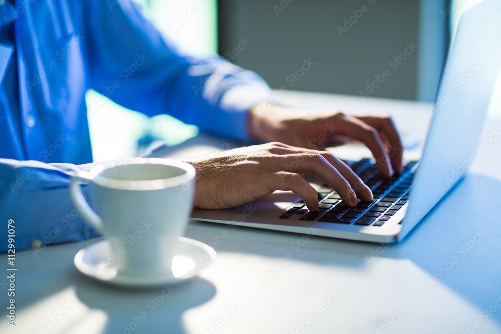 Poster man using laptop alone