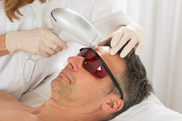 Man Receiving Laser Epilation Treatment