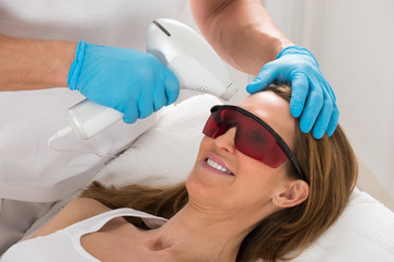 Woman Receive Laser Epilation In Beauty Clinic