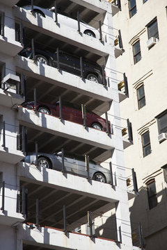A column of parked cars in a multi storey car park