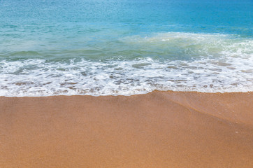 Fototapeta na wymiar Soft wave on the sandy beach