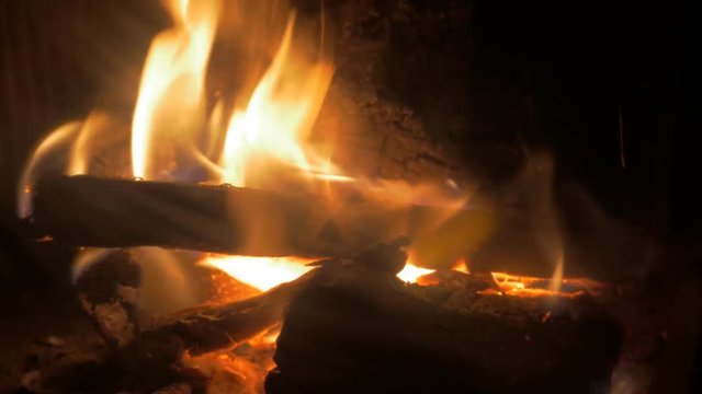 Warm relaxing ambient made from fireplace with logs burning 4K 2160p 30fps UltraHD footage - Wood-burning fireplaces tree logs arranged 4K 3840X2160 UHD video