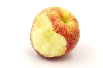 red apple with a heart shape from the bite on white background.