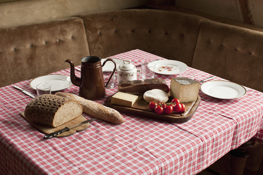 A simple rustic meal laid out on a set table