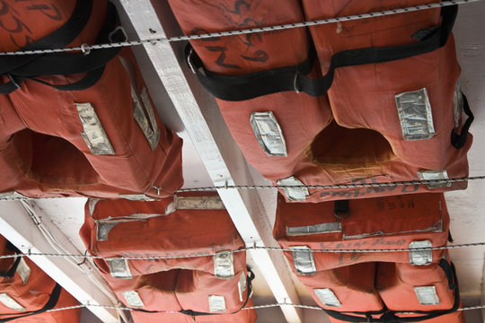 Detail of life vests stowed on a ship