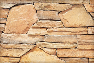 Stone wall texture or background. Brown color.