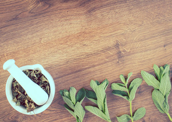 Vintage photo, Fresh green and dried mint with mortar, healthy lifestyle, copy space for text