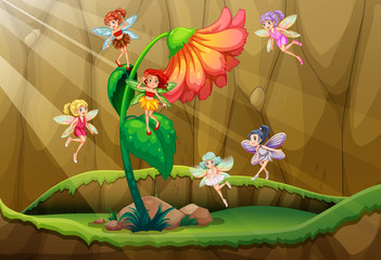 Fairies flying around the flower