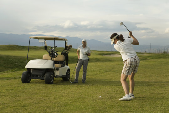 Two women playing golf together, Palm Springs, California, USA