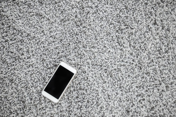 Smart phones on the gray carpet.