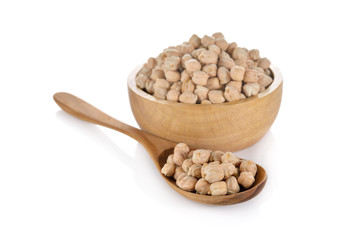 garbanzo beans in wooden bowl and spoon on white background