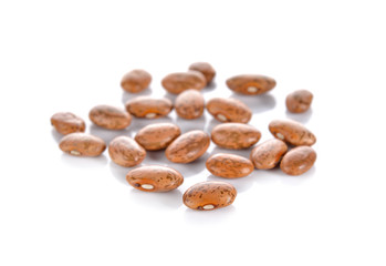 dry pinto beans on white background
