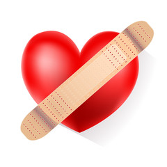 red heart with plaster on white background