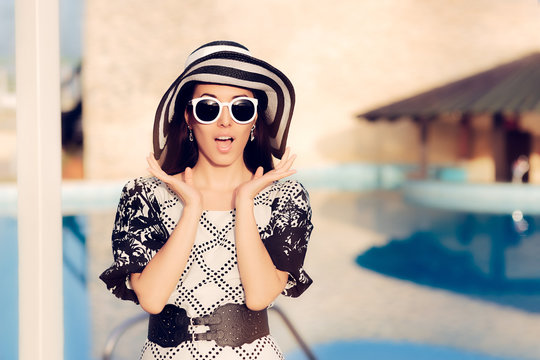 Surprised  Woman With Sunglasses and Sun Hat by the Pool 