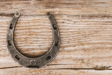 metal horseshoe on a wooden background
