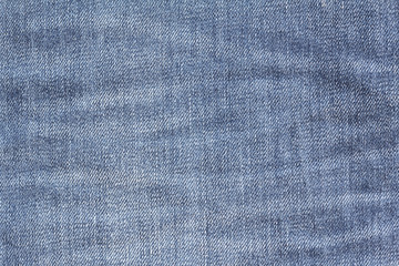 Closeup denim jeans texture. Stitched textured blue denim jeans background. Old grunge vintage denim jeans. Denim jeans of fashion design.