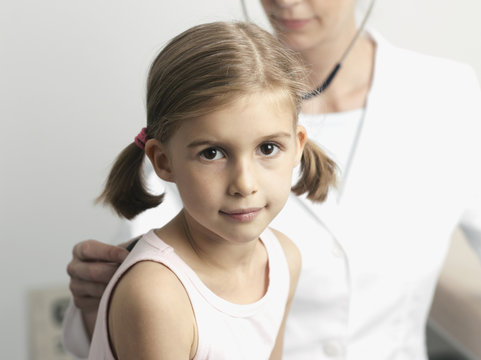 A young girl getting a medical Exam