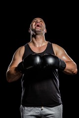 Fototapeta na wymiar Boxer in boxing gloves laughing