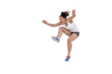 Athletic woman running on white background