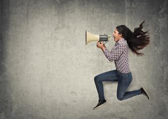 Woman screaming into a megaphone