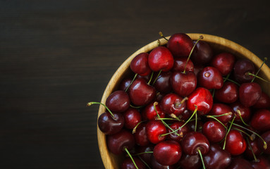 fresh cherries on wooden table