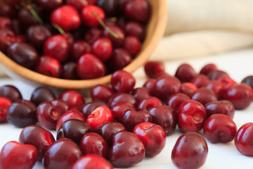 fresh cherries on wooden table