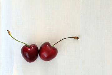 fresh cherries on wooden table