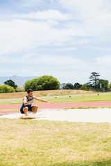Athlete landing on sandpit