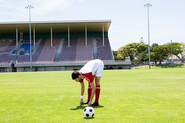 Football player warming up in stadium