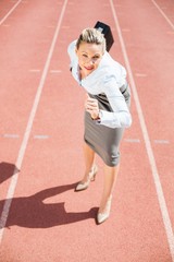 Fototapeta premium Portrait of businesswoman in ready to run position