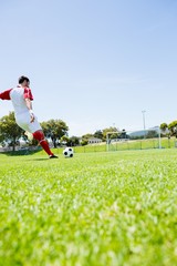 Football player practicing soccer