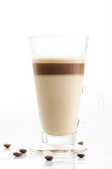 Latte macchiato with coffee beans isolated on white background