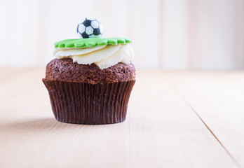 Delicious cupcake on table