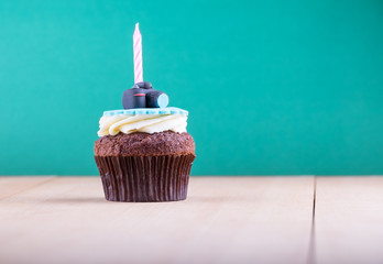Delicious cupcake on table