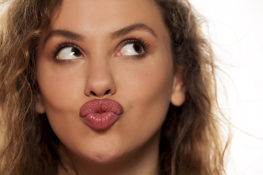 beautiful young woman with pursed lips
