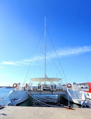 Fototapeta premium Catamaran anchored in the harbor