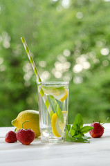 Summer lemonade . Lemon and mint, strawberry on the table